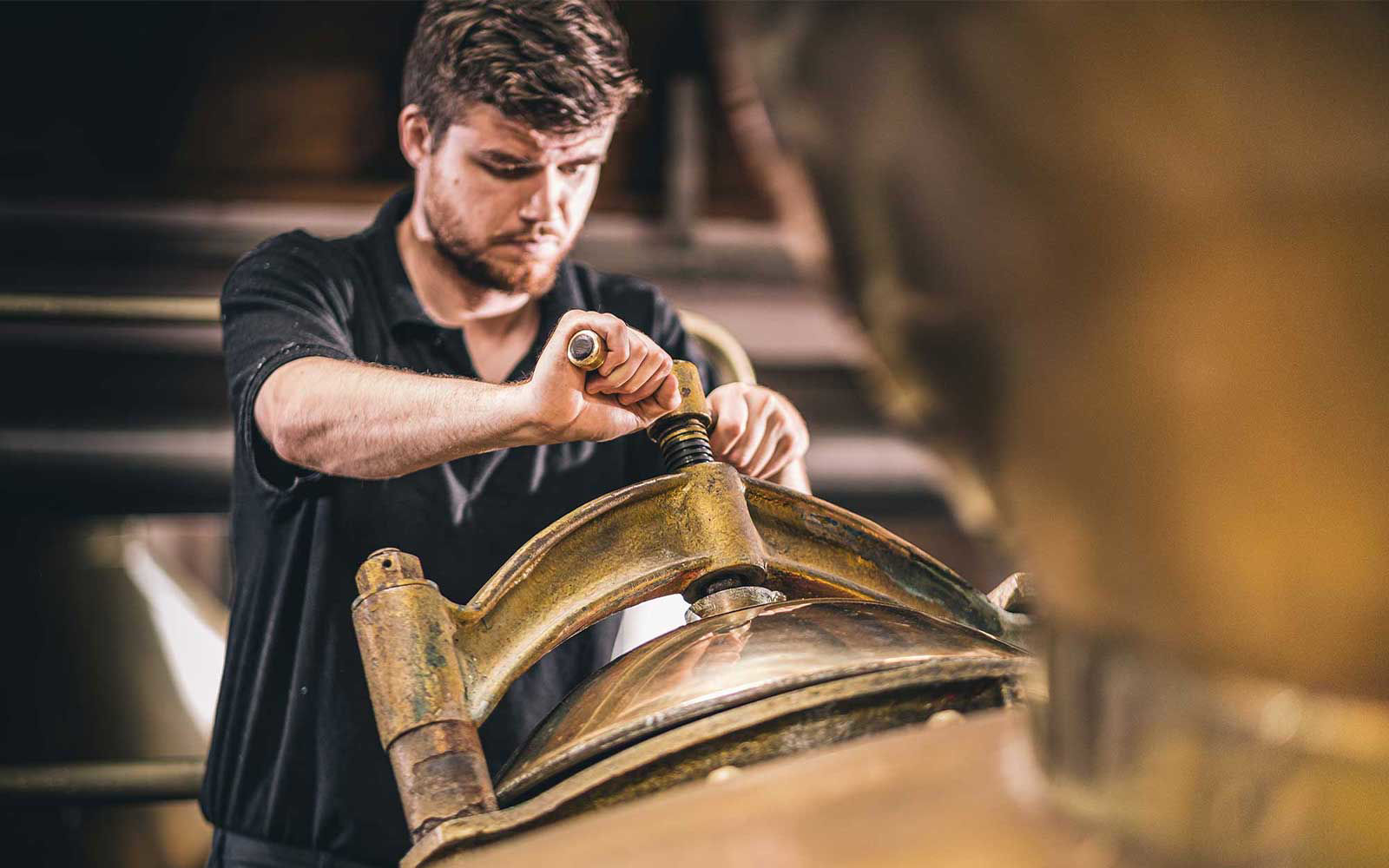 man distilling whisky