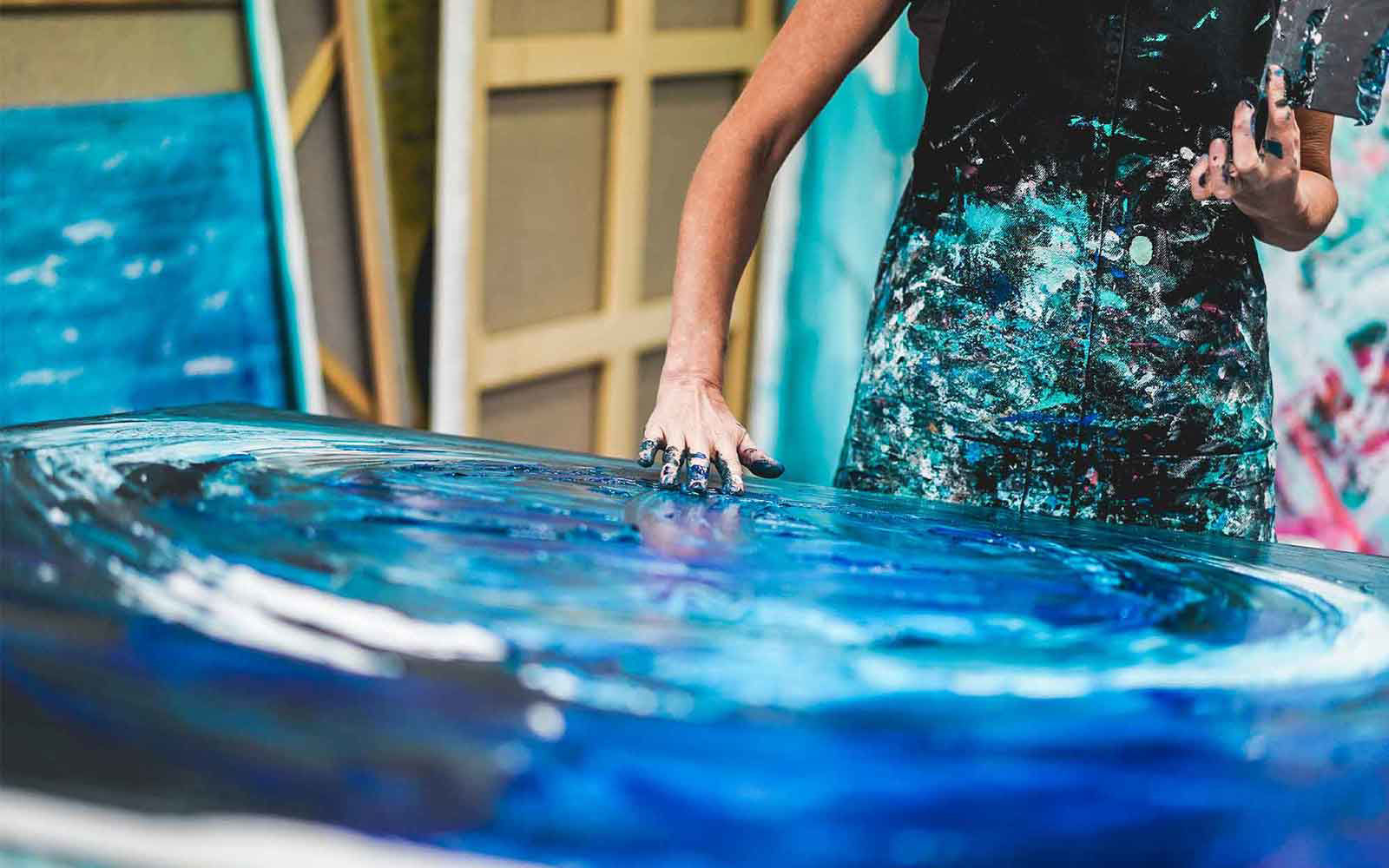 woman painting with hands