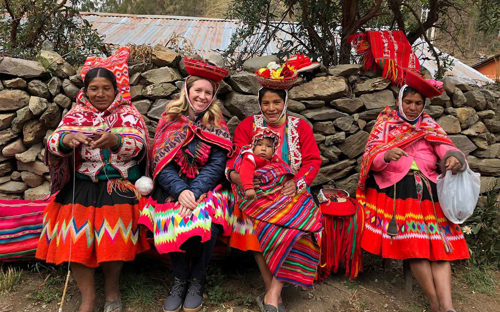 woman learning traditional peruvian garment weaving